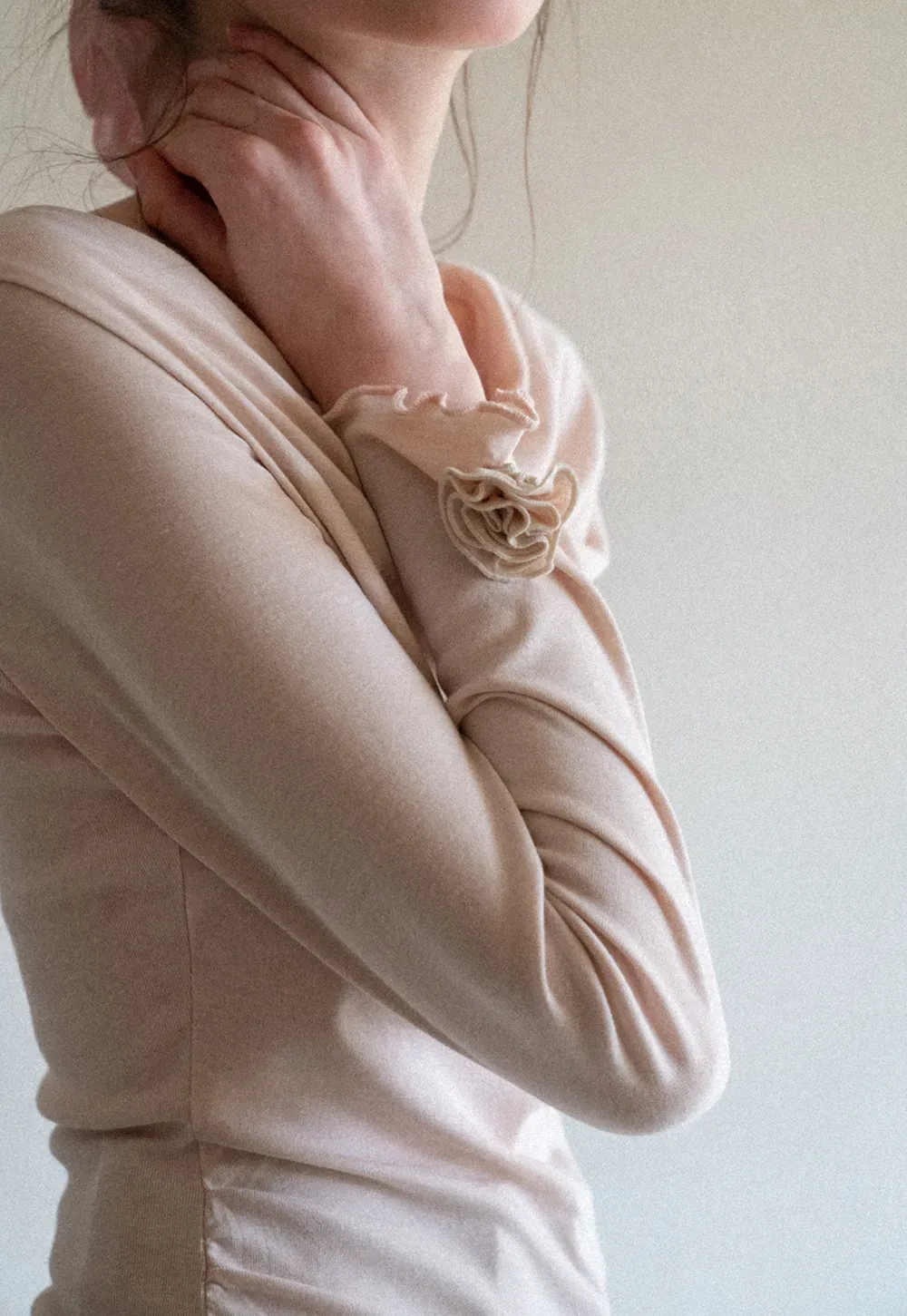 Long sleeve top with ruffled hem and cuffs