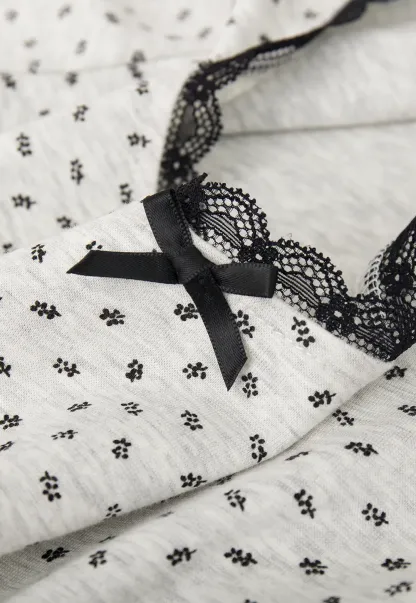 Polka dot dress with lace trim and matching cardigan