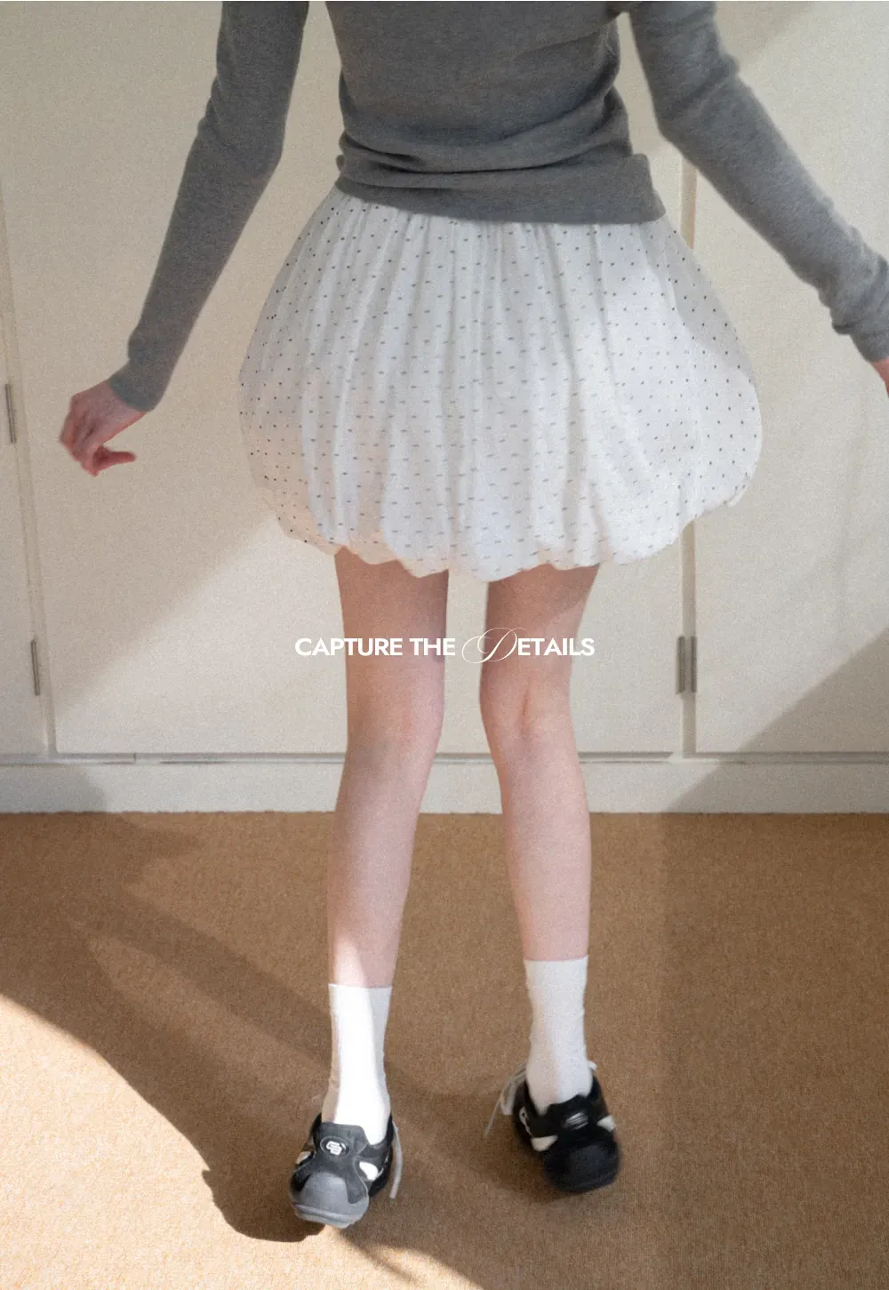 Polka dot pleated mini skirt with drawstring waist