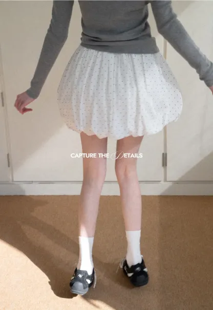 Polka dot pleated mini skirt with drawstring waist