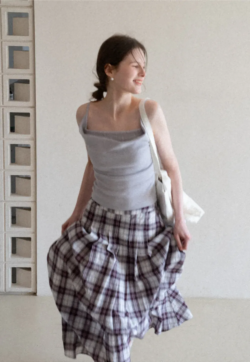 Silk-like tank top with thin straps and draped neckline