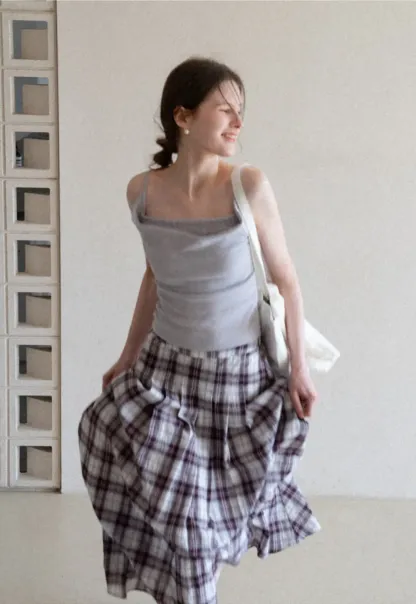 Silk-like tank top with thin straps and draped neckline