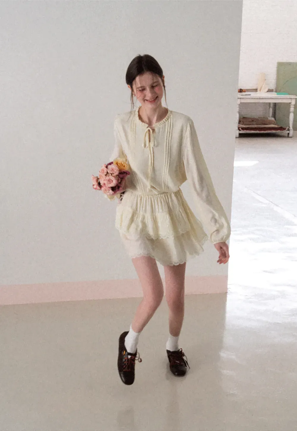 Shirt with ruffled collar and tie front layered skirt