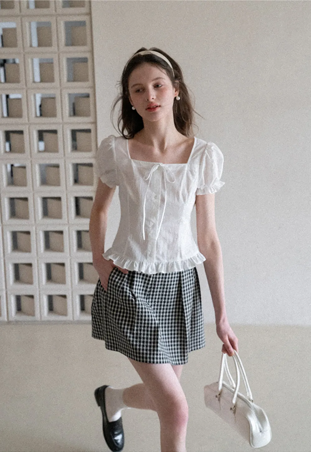 Plaid skirt with pleats and ruffled top