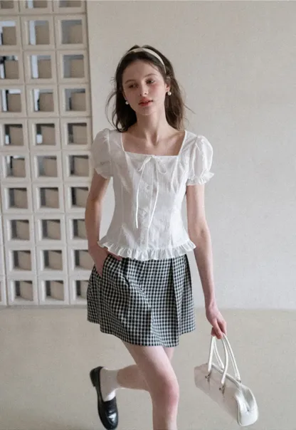 Plaid skirt with pleats and ruffled top