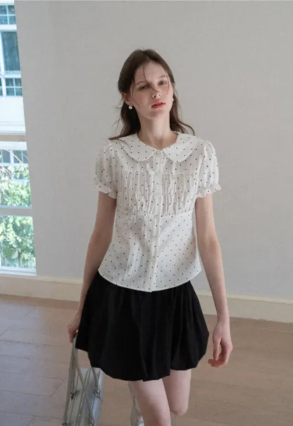 Polka dot shirt with ruffled sleeves and Peter Pan collar