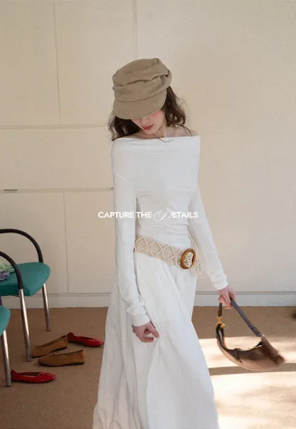 Elegant asymmetrical long sleeve dress with unique belt design