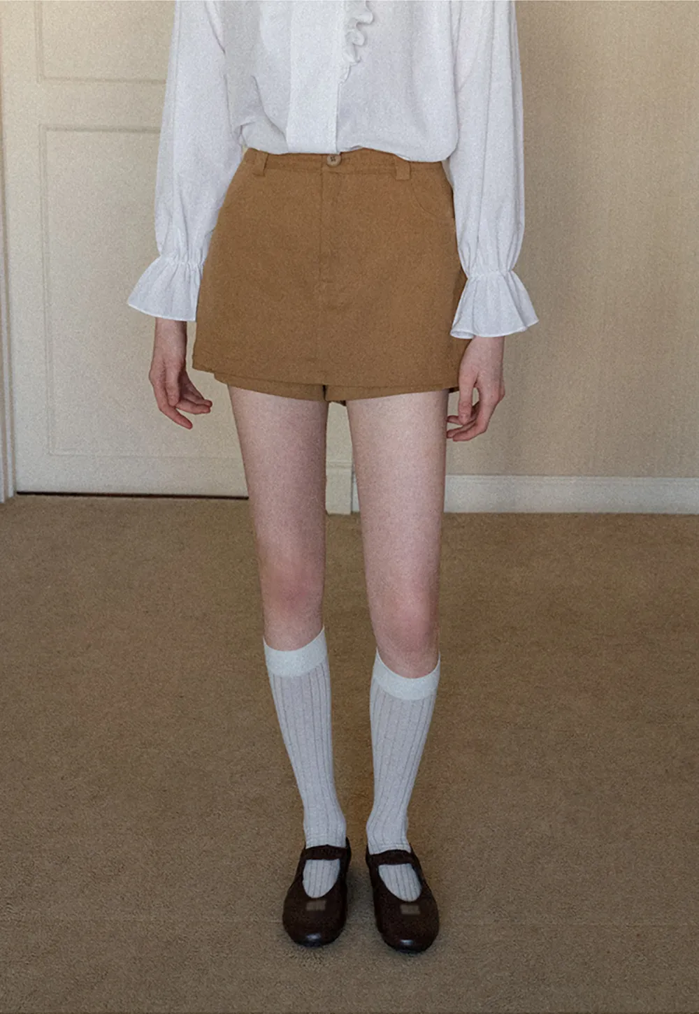 High waist pleated mini skirt with button front design