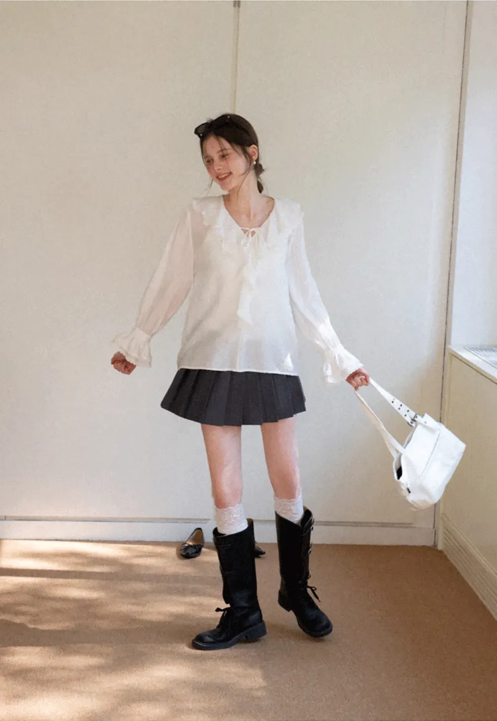 Elegant Blouse with Ruffled Neckline and Flared Sleeves