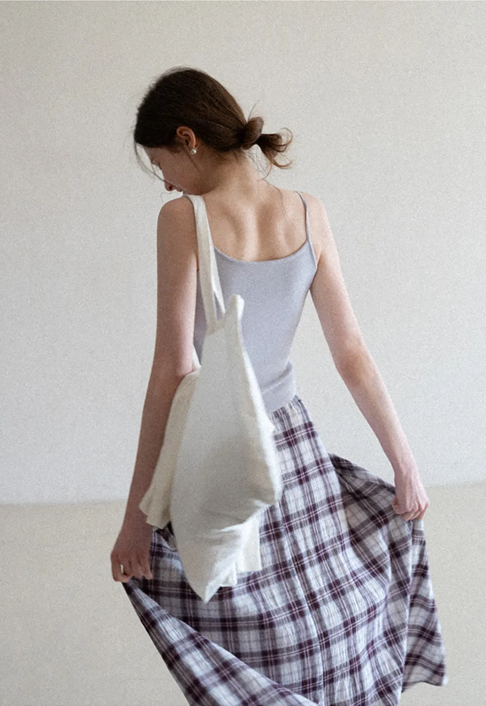 Silk-like tank top with thin straps and draped neckline