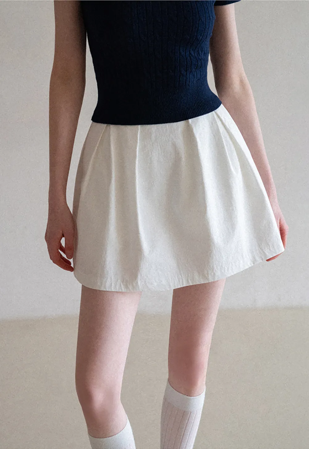 Plaid skirt with pleats and ruffled top