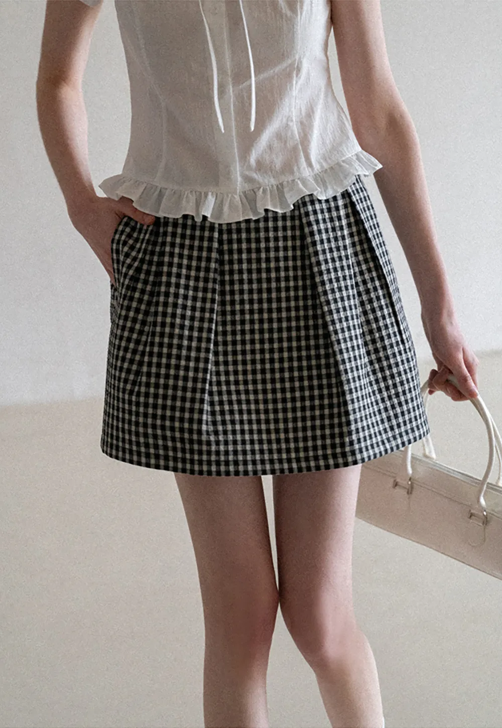 Plaid skirt with pleats and ruffled top