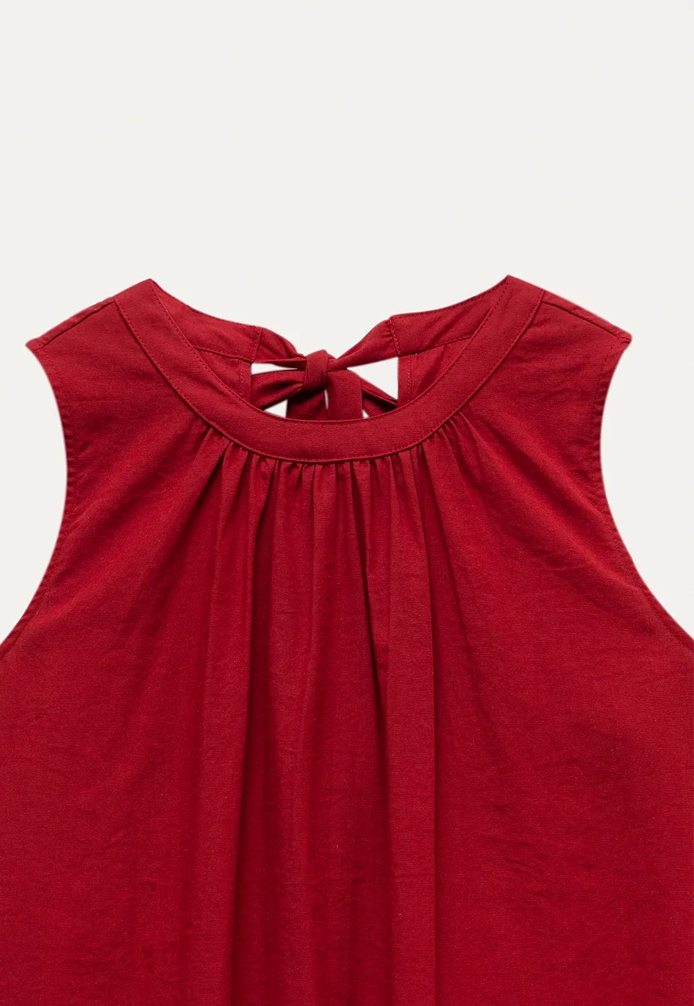 Women’s Sleeveless Ruffle Hem Top with Back Bow Tie