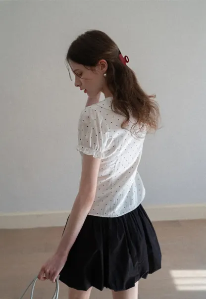 Polka dot shirt with ruffled sleeves and Peter Pan collar