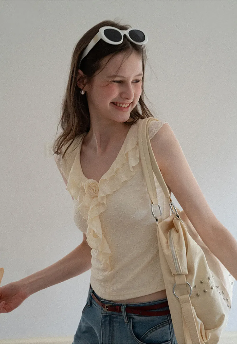 Sleeveless Top with Ruffled V Neck and Floral Detail