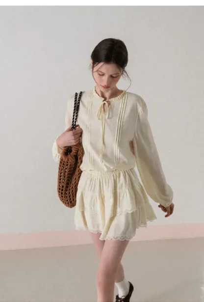 Shirt with ruffled collar and tie front layered skirt