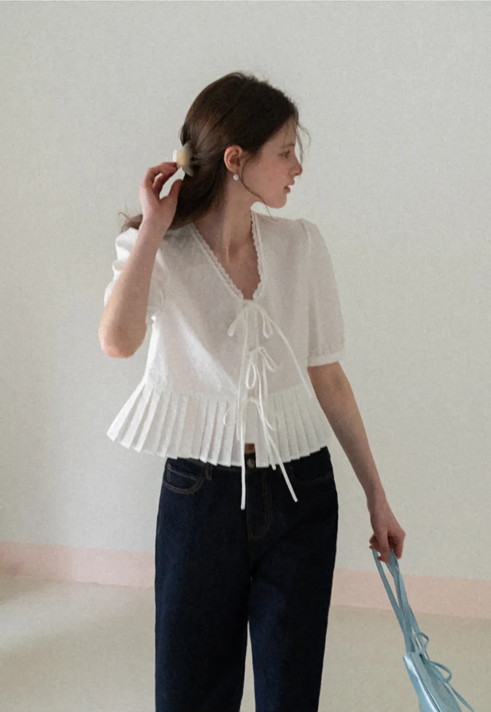 V neck short sleeve blouse with pleated hem and tie front