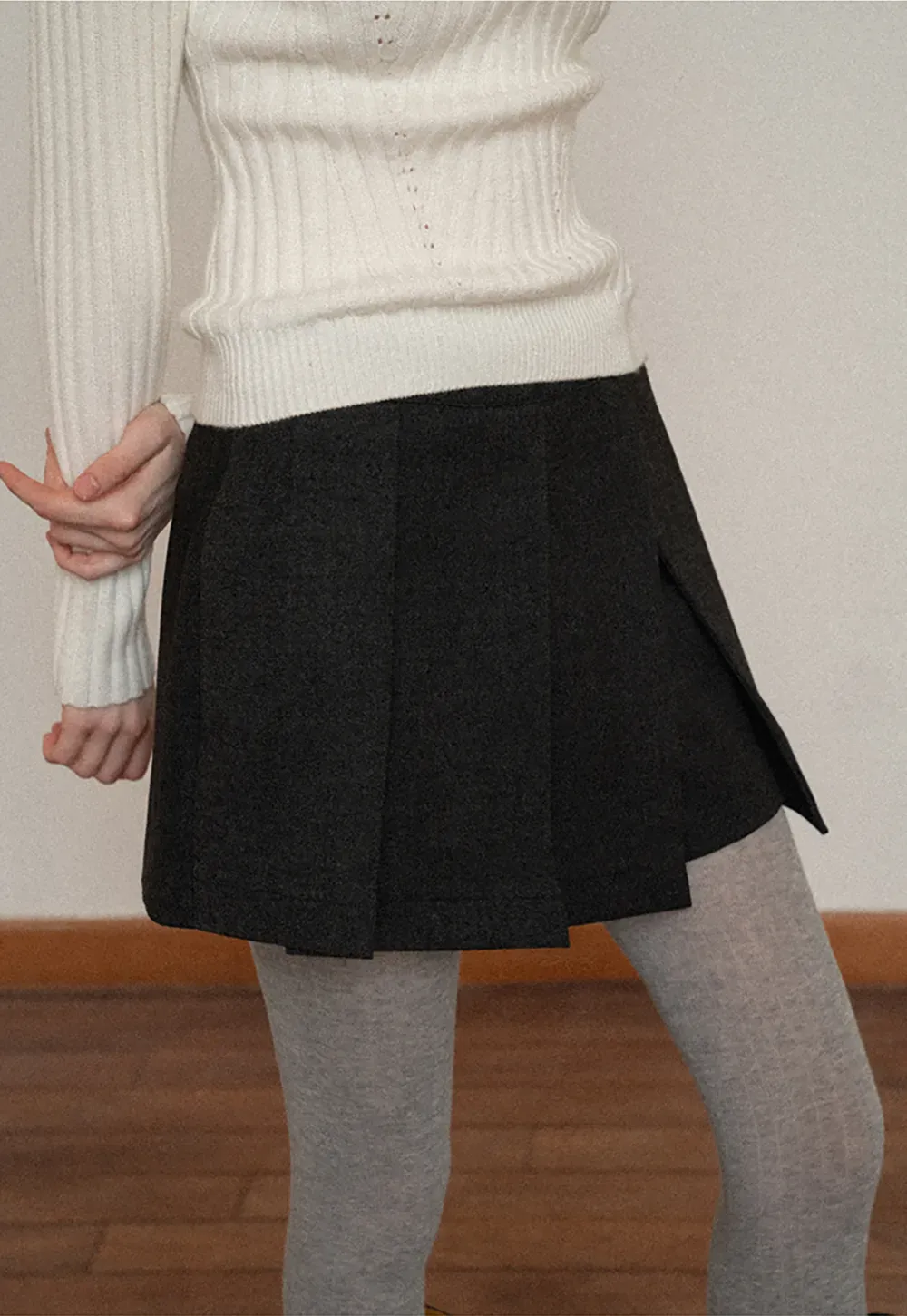 Elegant Pleated Mini Skirt with Tights and Boots Combo