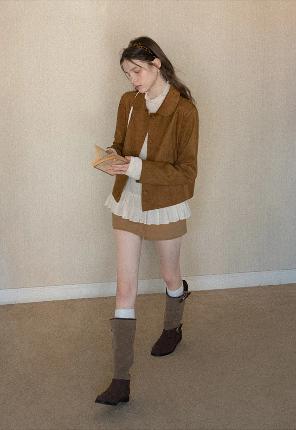 High waist pleated mini skirt with button front design