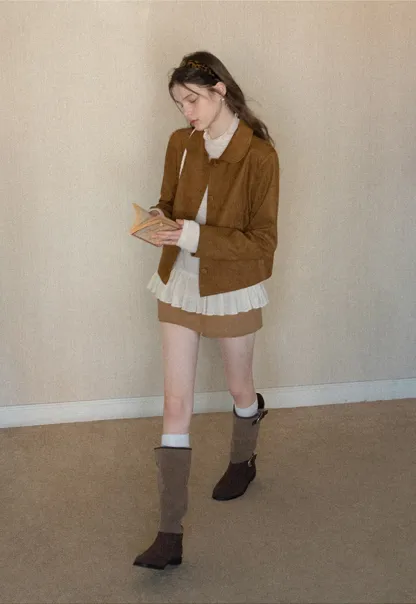 High waist pleated mini skirt with button front design