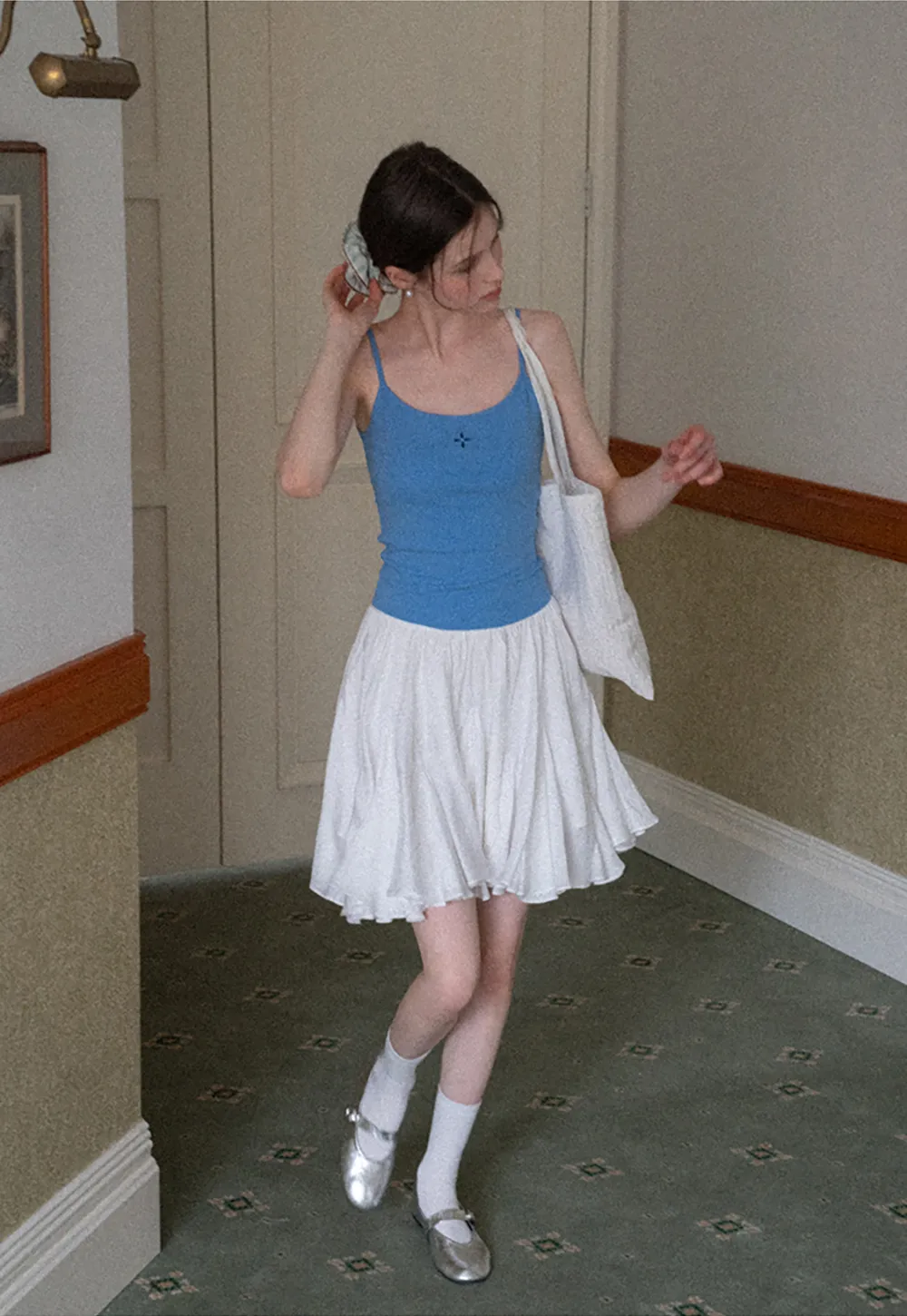 Gray tank top with small embroidered cross detail