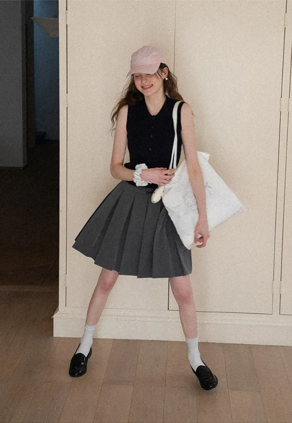 Pleated skirt with front bow detail