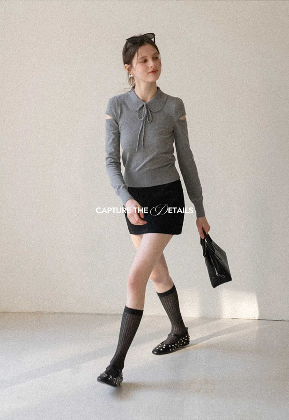 Elegant Knit Sweater with Bow Detail and Cutout Sleeves