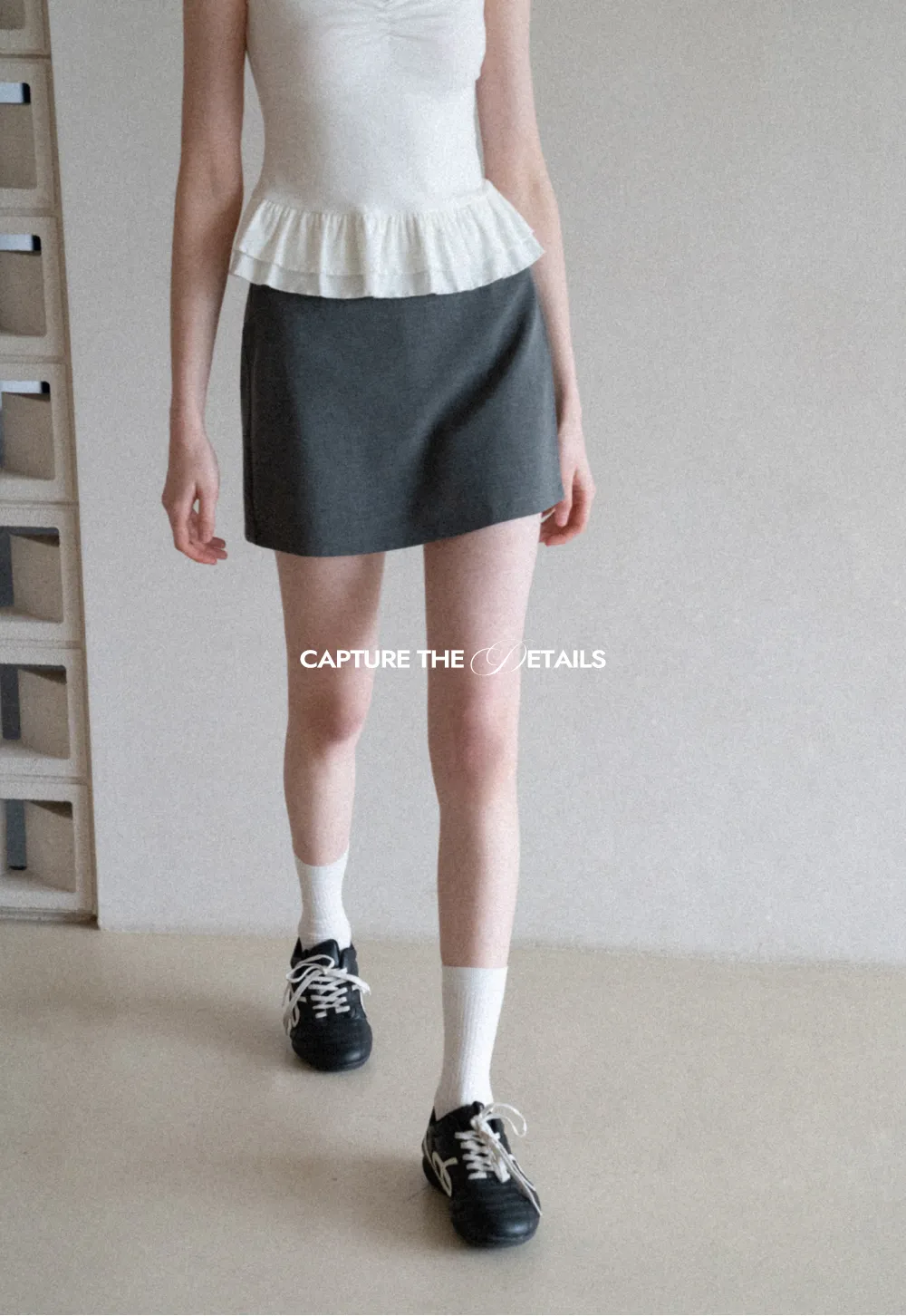 Elegant Pleated Mini Skirt with Asymmetrical Hem