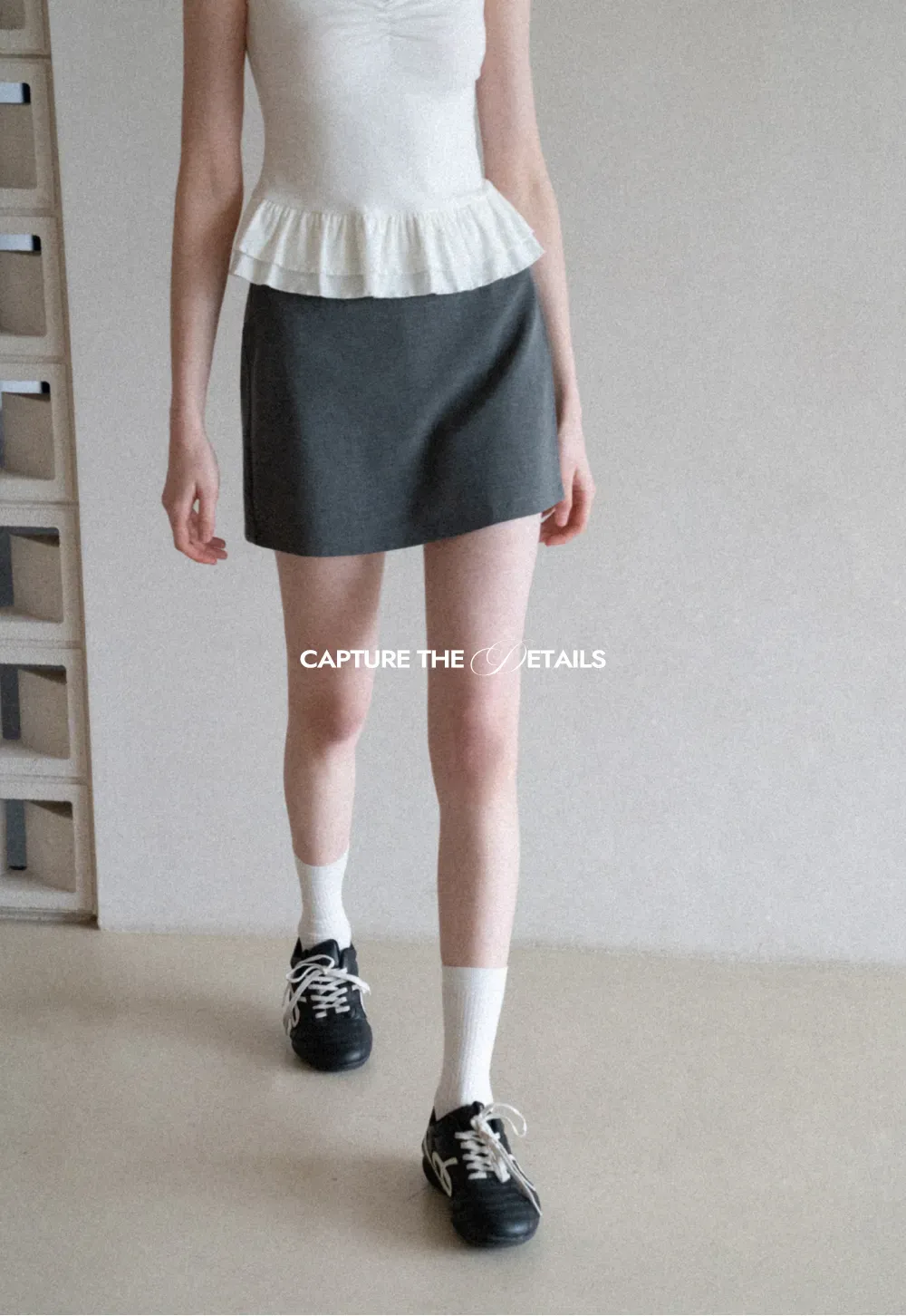 Elegant Pleated Mini Skirt with Asymmetrical Hem