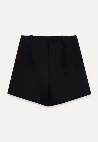 High waist pleated shorts with flared hem