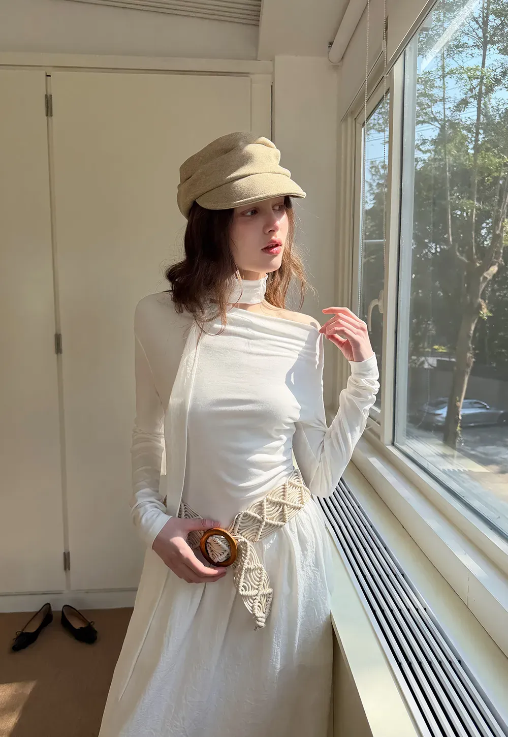 Elegant asymmetrical long sleeve dress with unique belt design