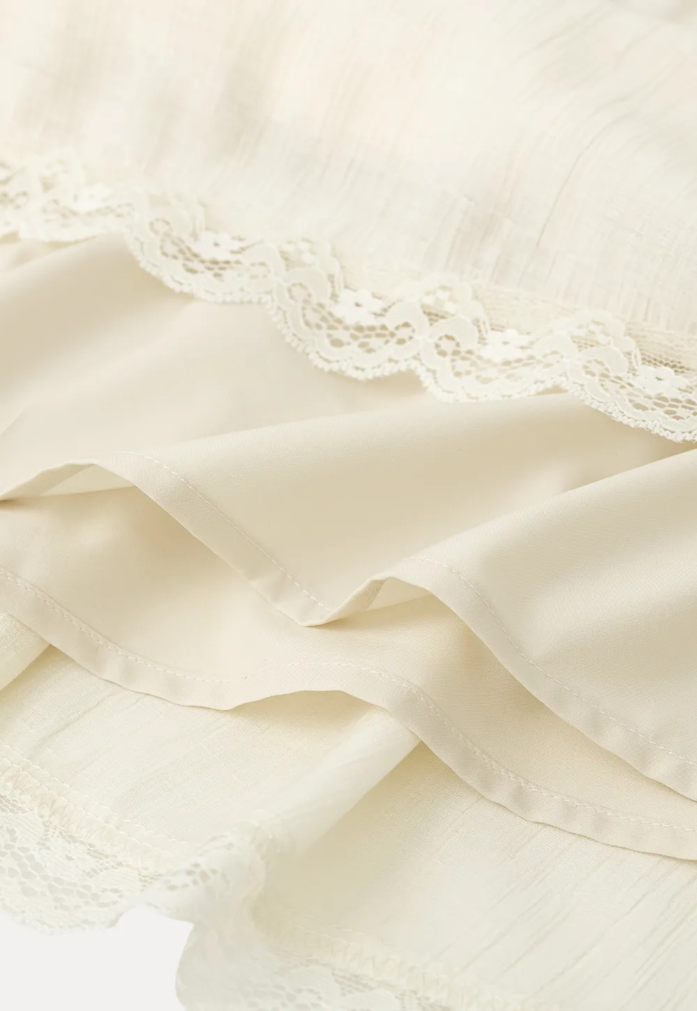 Shirt with ruffled collar and tie front layered skirt