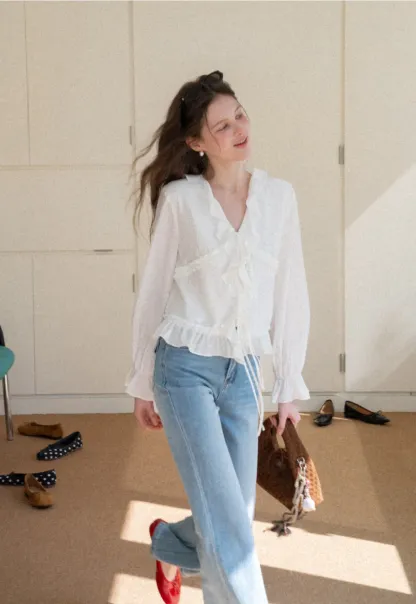 Elegant Blouse with Ruffle Detail and Tie Front Design