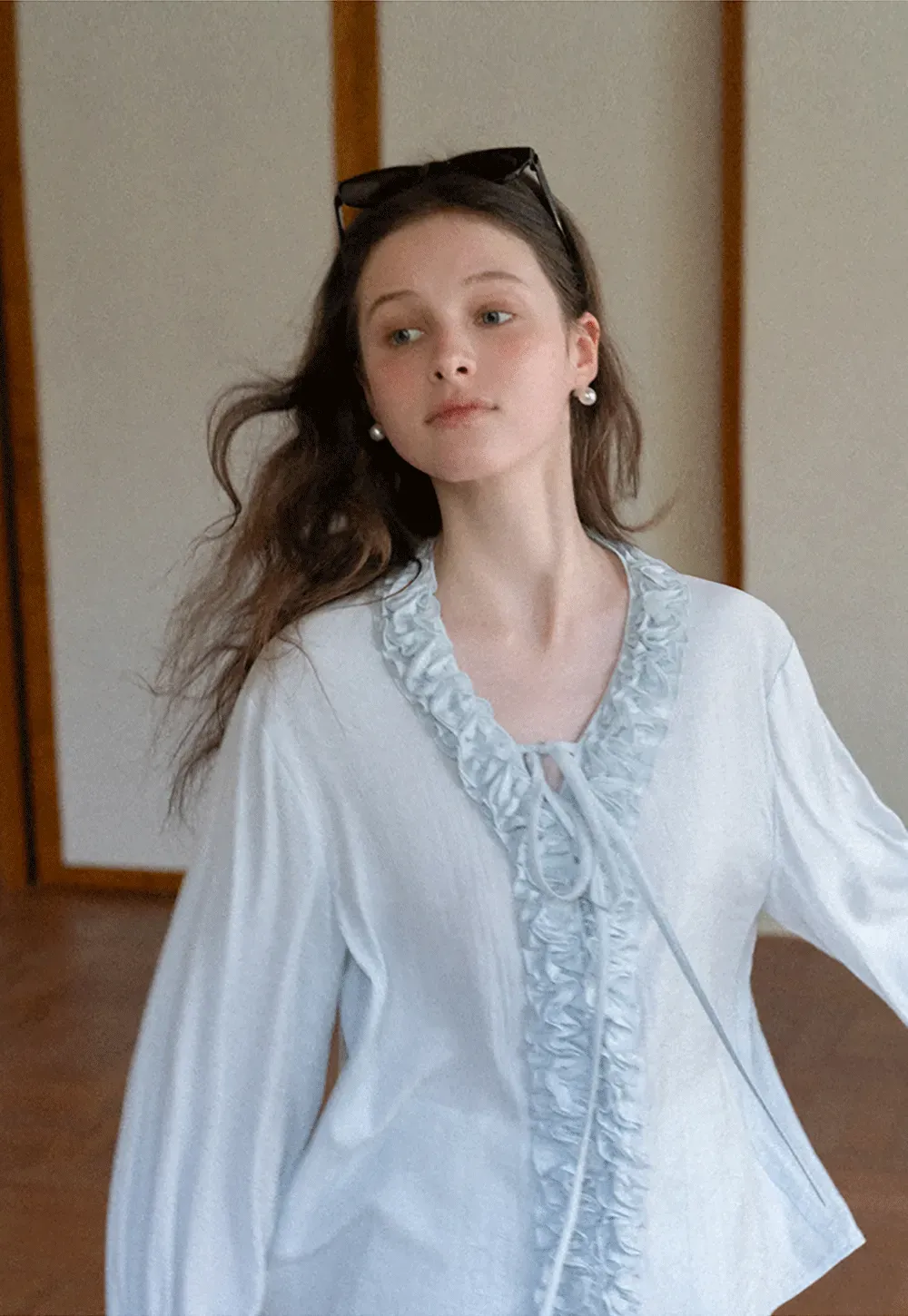 Long sleeve shirt with ruffled neckline and gathered cuffs