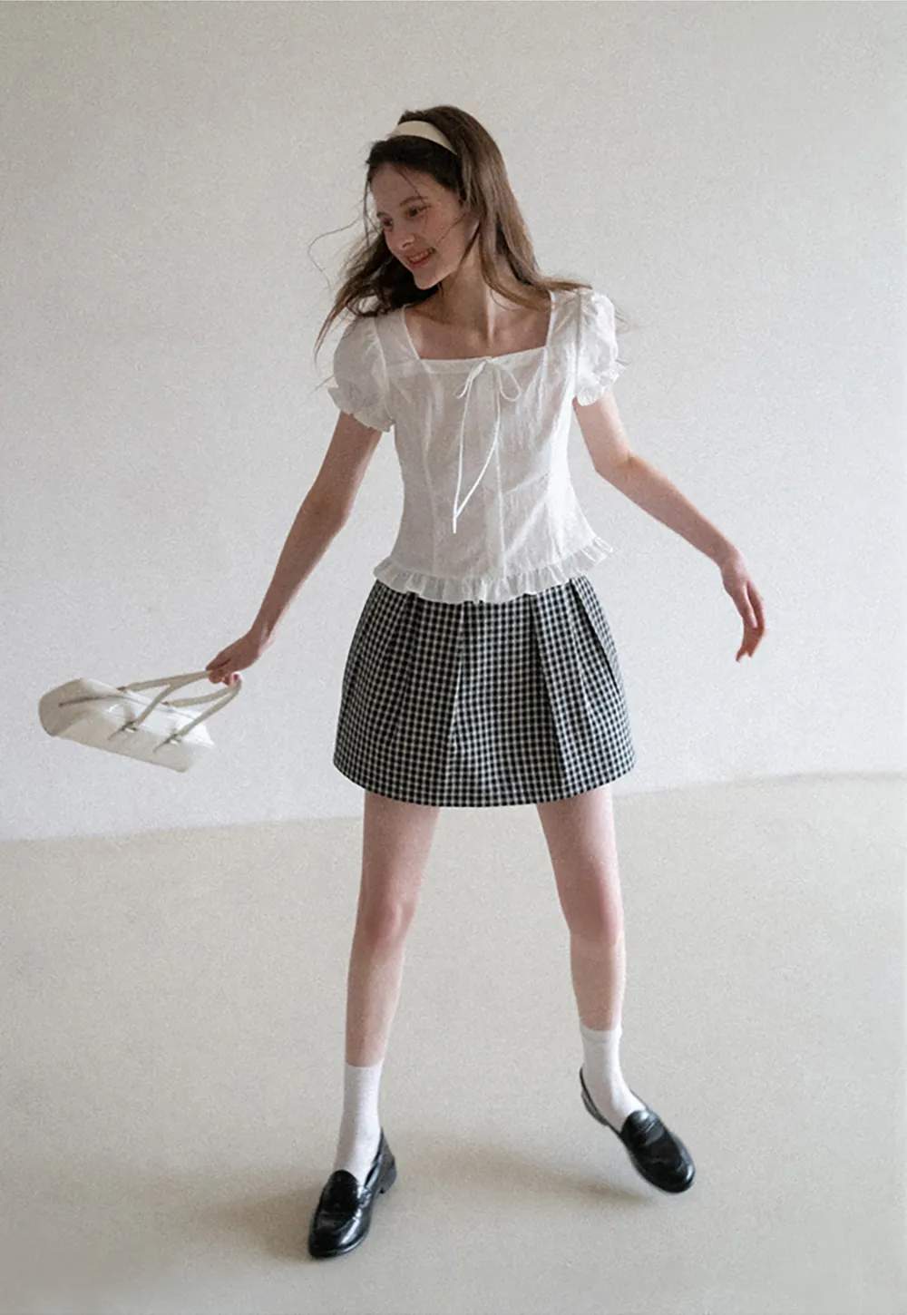 Plaid skirt with pleats and ruffled top