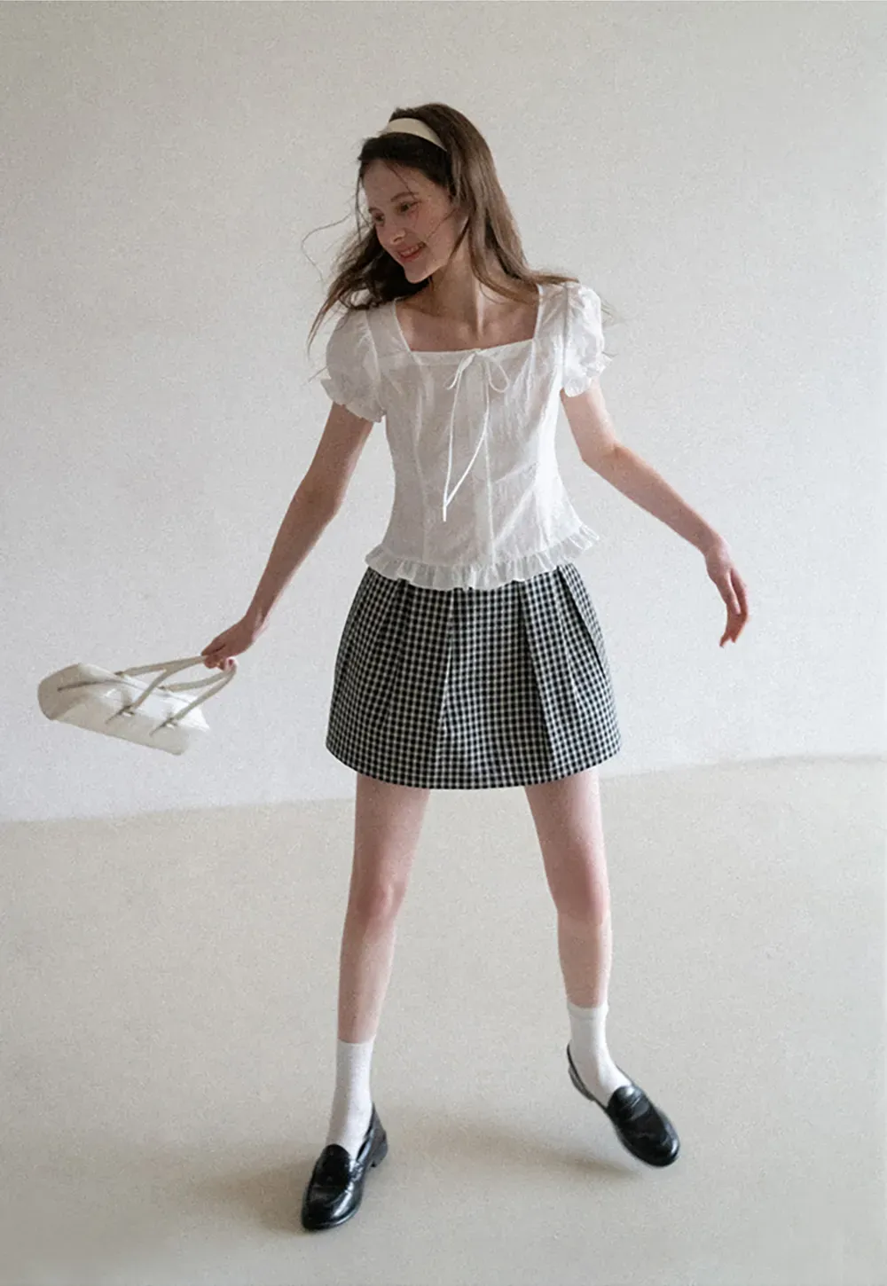 Plaid skirt with pleats and ruffled top