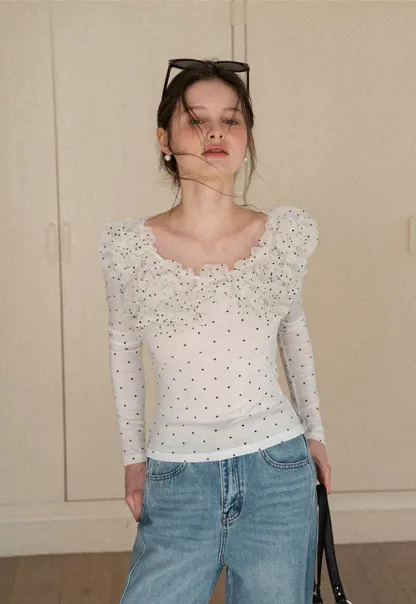 Polka dot long sleeve top with ruffled neckline