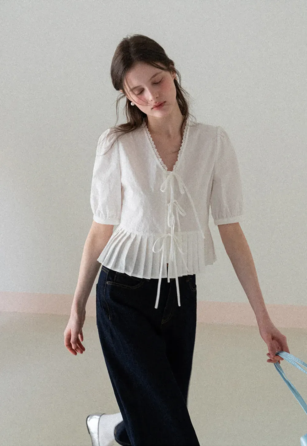 V neck short sleeve blouse with pleated hem and tie front