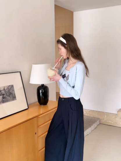 Woolen knit sweater with argyle pattern and buttons