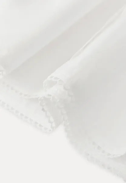 Long sleeve button front shirt with scalloped hem