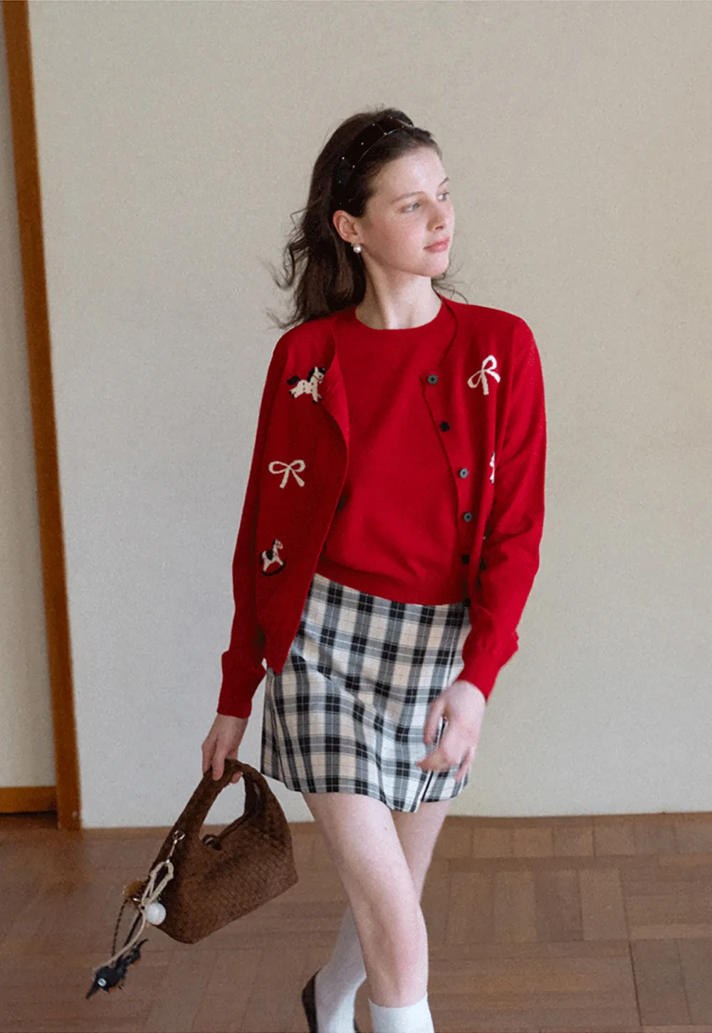 Woolen knit sweater with horse and bow motifs