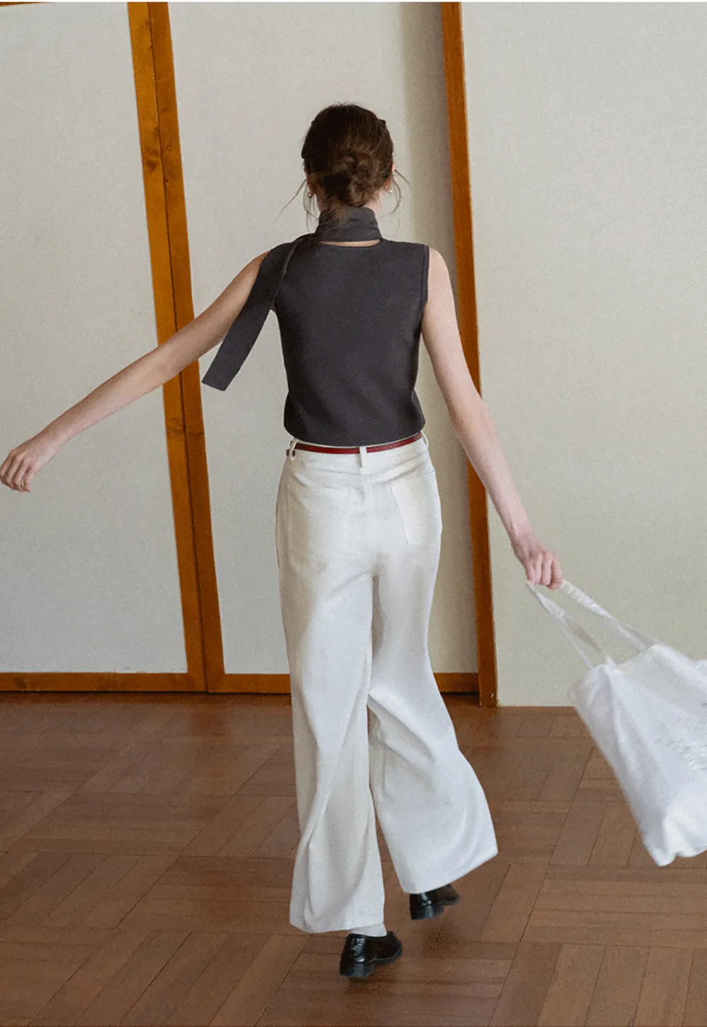 Sleeveless high neck knit top with side tie detail