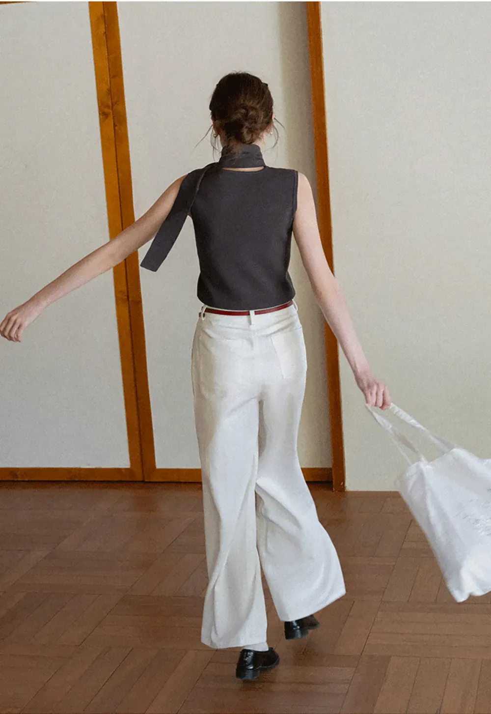 Sleeveless high neck knit top with side tie detail