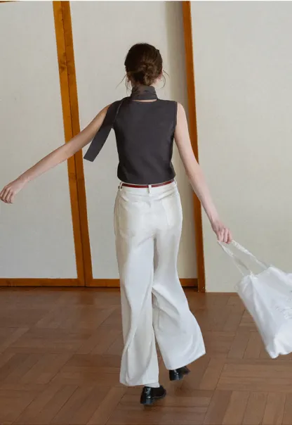 Sleeveless high neck knit top with side tie detail