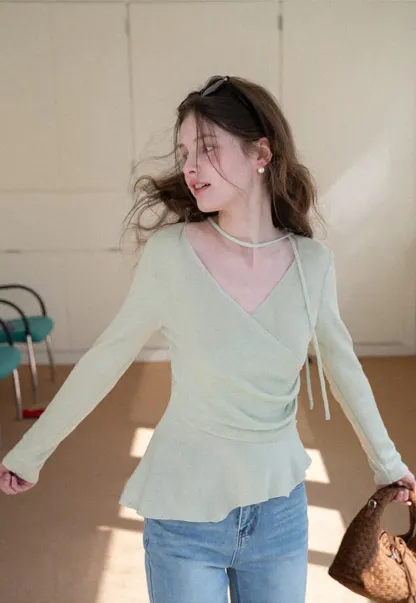 Long sleeve wrap knit sweater with ruched detail