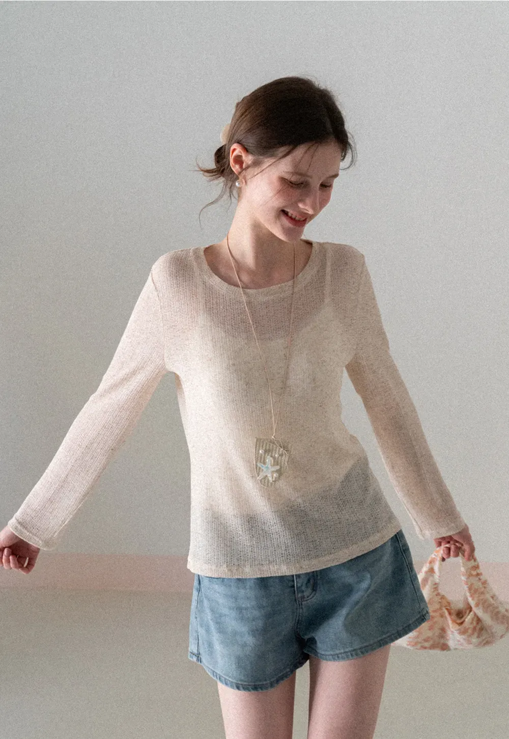 Long sleeve sheer knit top with round neckline