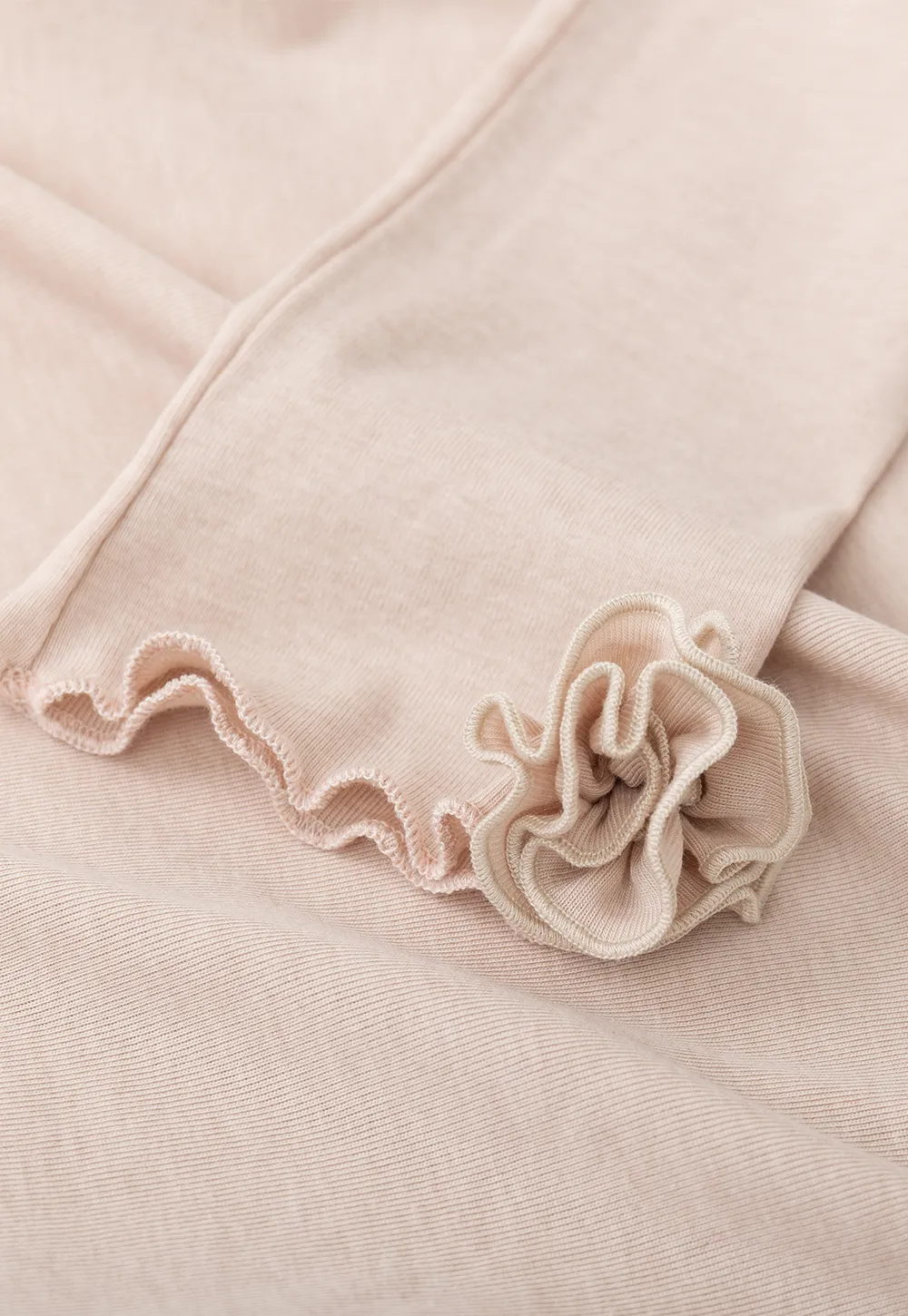 Long sleeve top with ruffled hem and cuffs