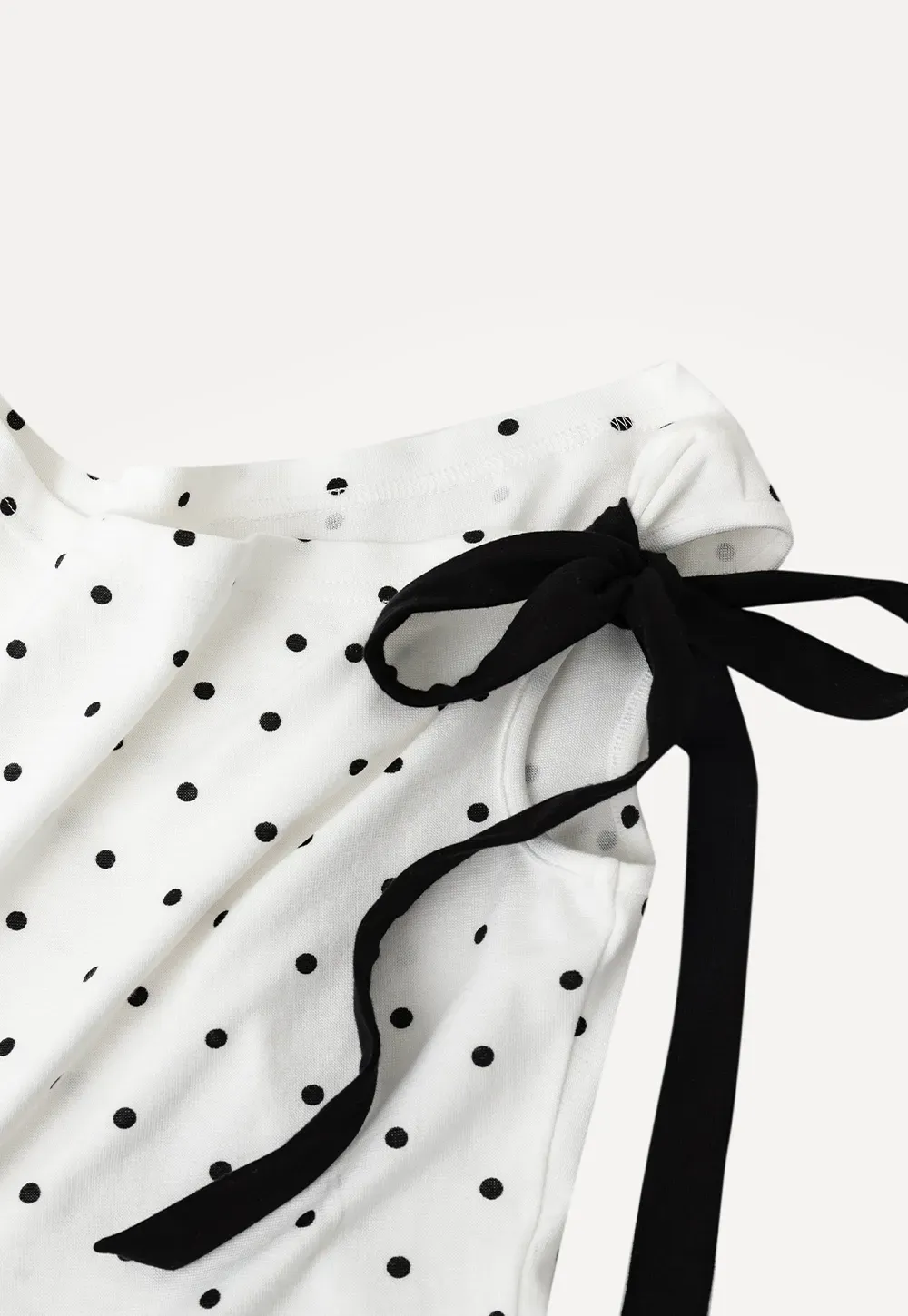 Polka dot one shoulder top with bow detail