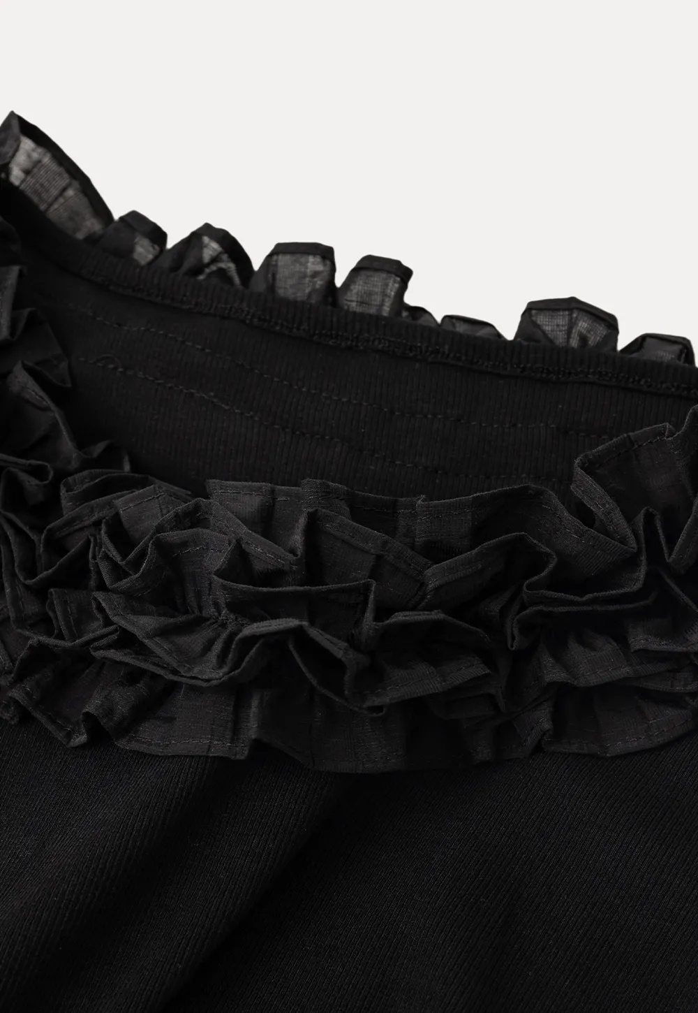 Short sleeve knit top with ruffled neckline