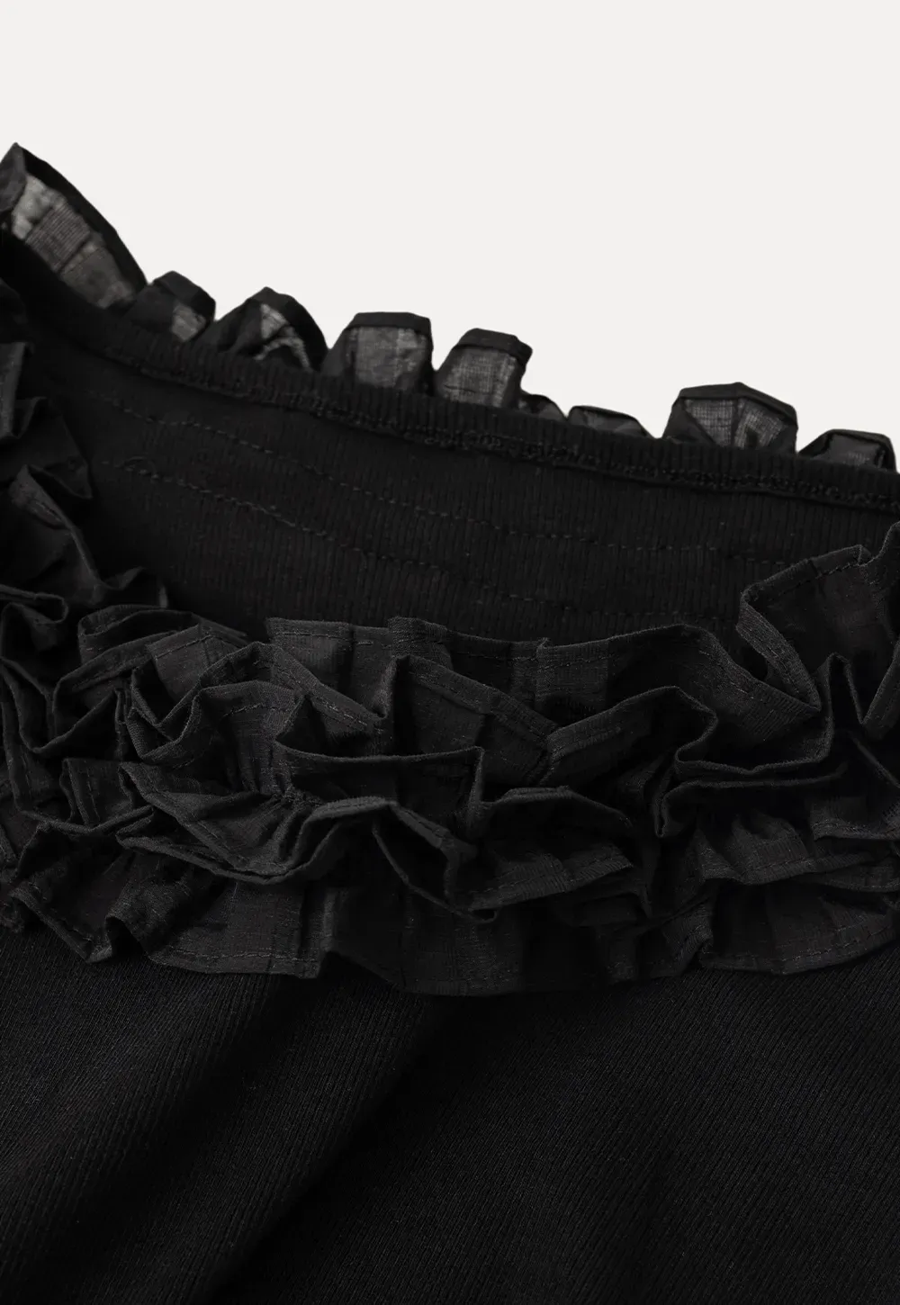 Short sleeve knit top with ruffled neckline